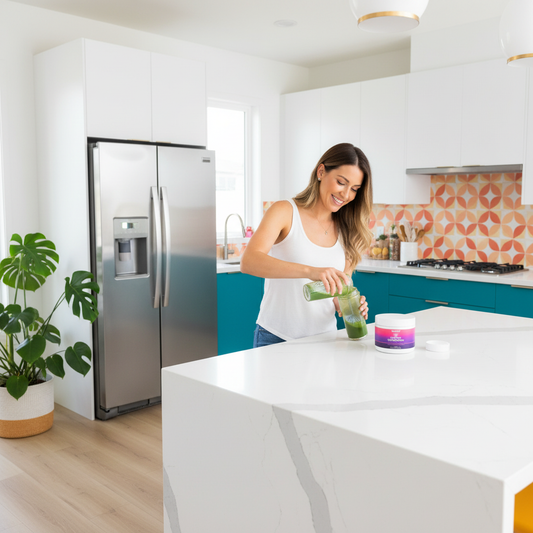 Woman mixing greens in vibrant kitchen with product on counter